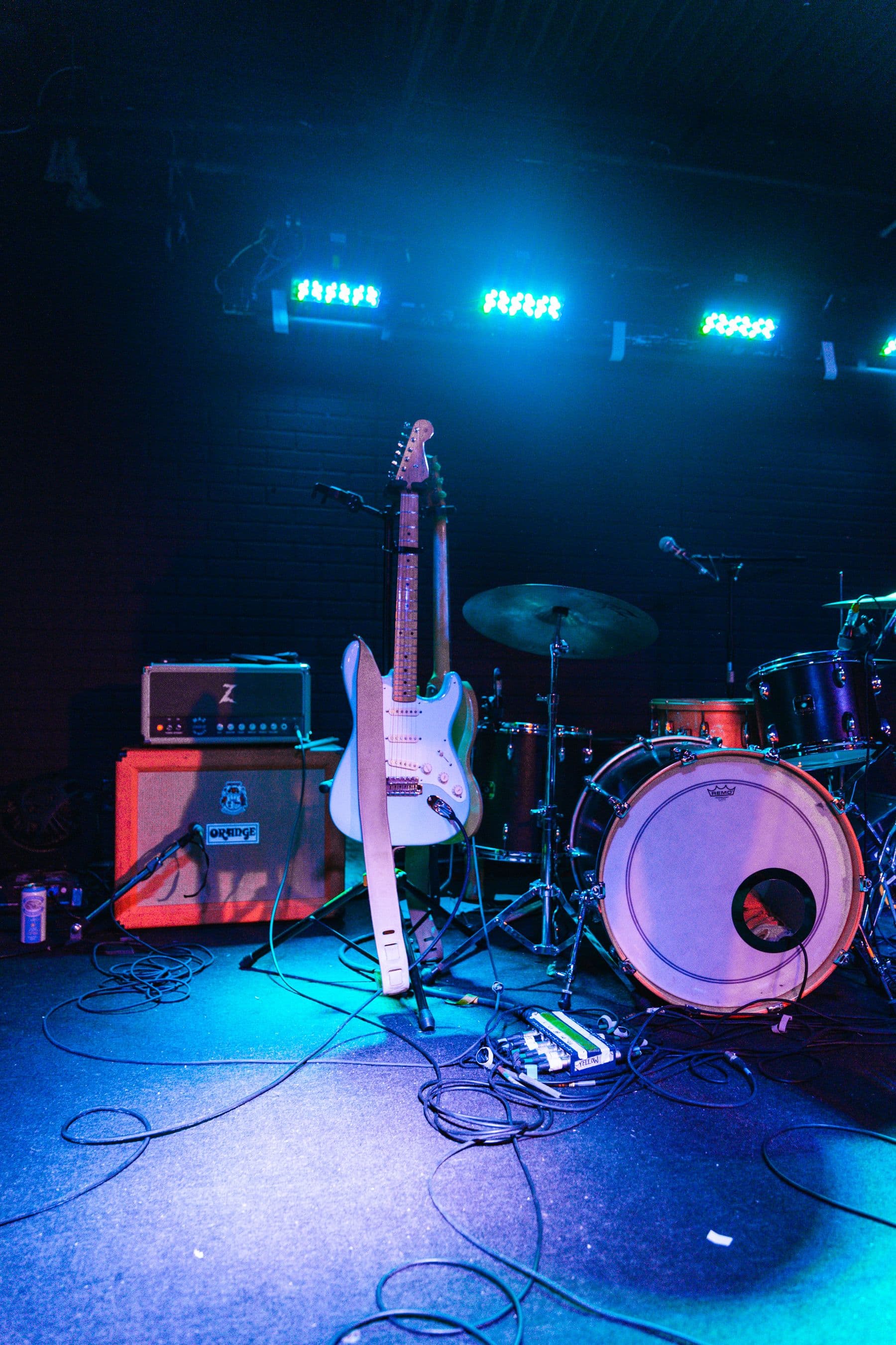 Instruments set up on an empty stage before a show
