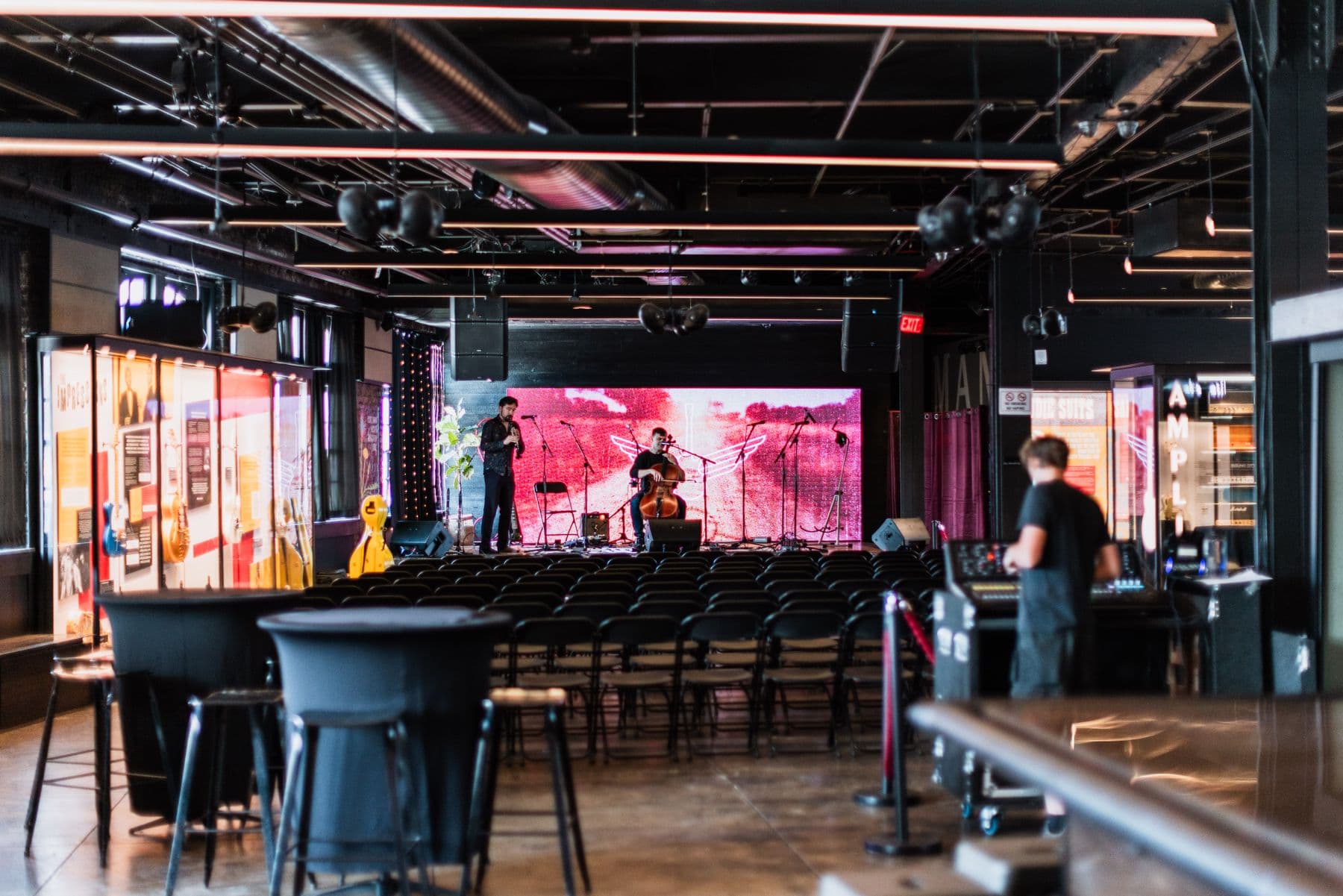 Musicians setting up on an empty stage before a show